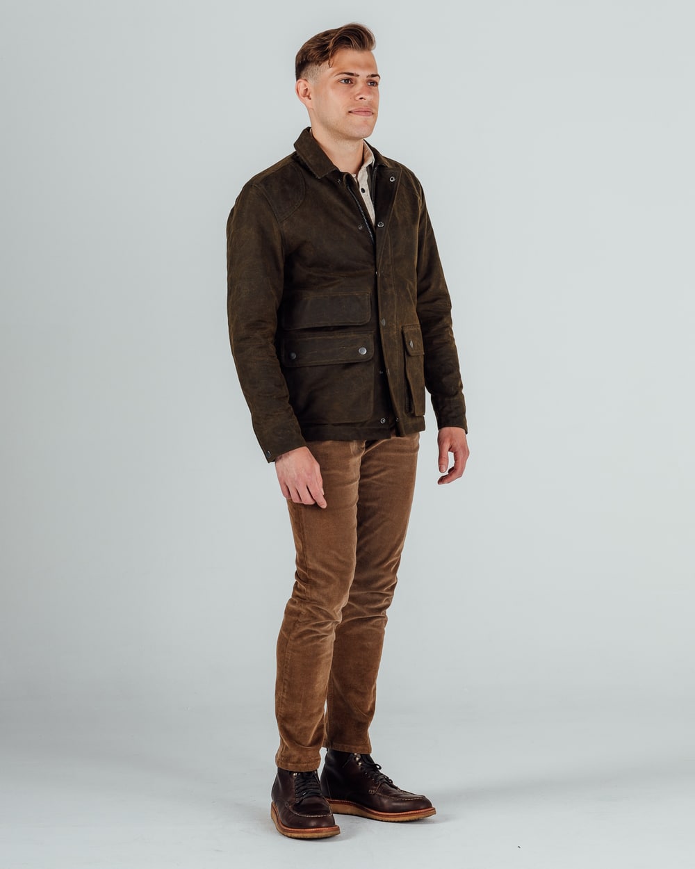 Ryan Wearing Brow Jacket and Brown Pants