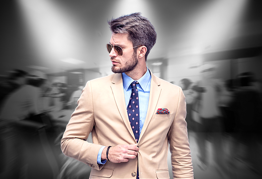 Man in suit and sunglasses with black and white background 