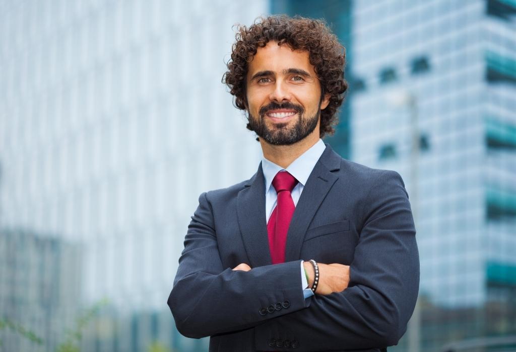 smiling man in suit looks attractive