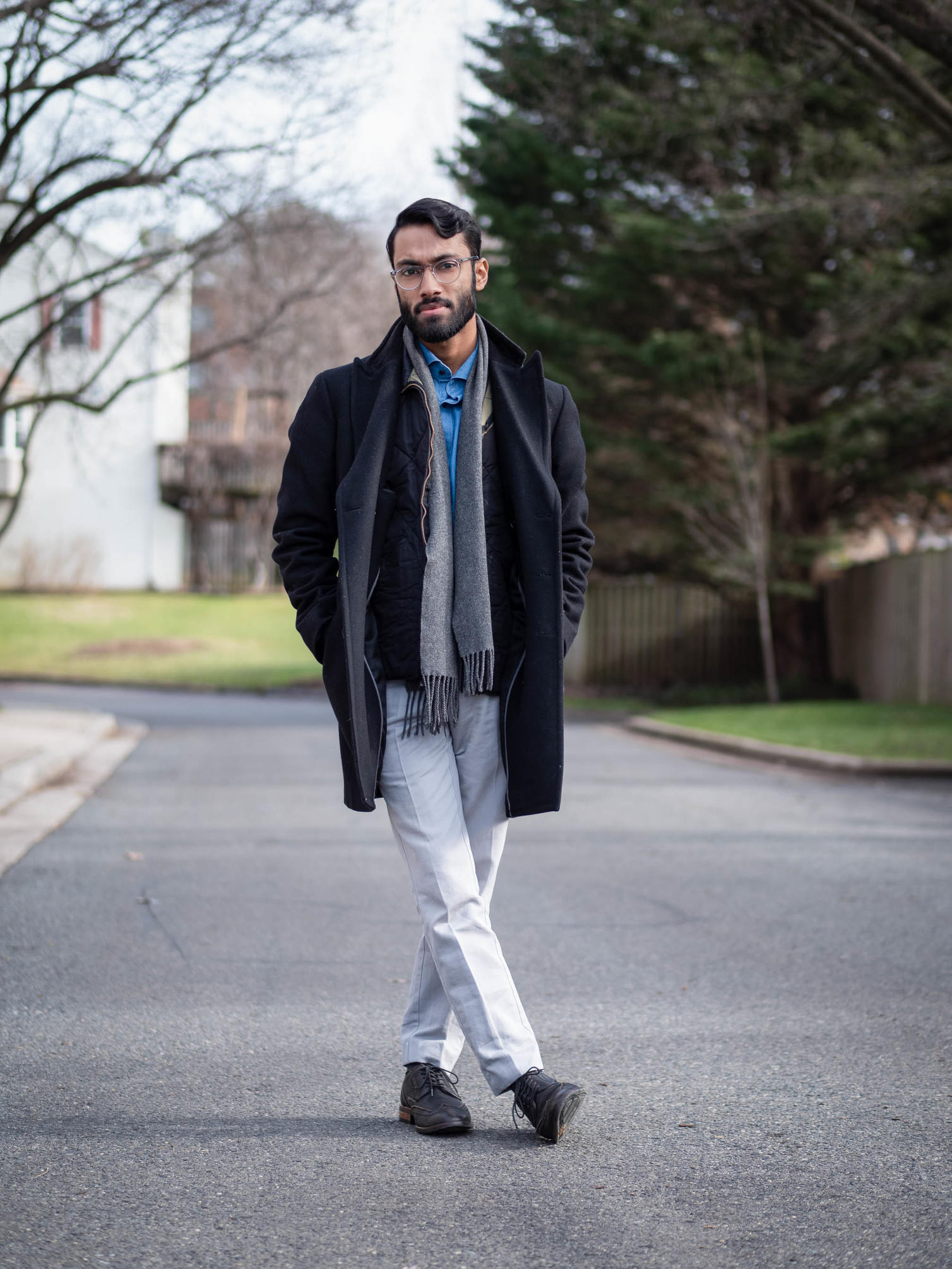 Rajesh wearing blue shirt, navy jacket and khaki chinos