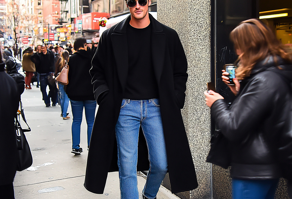 Jacob Elordi wearing black overcoat over jeans and a black tee