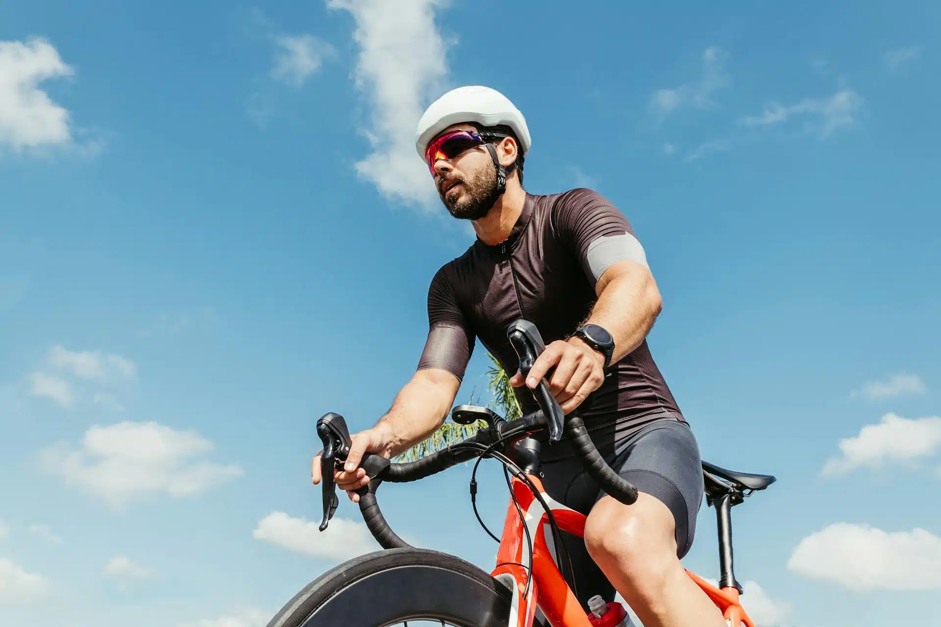 A professional cyclist riding his sports bicycle.