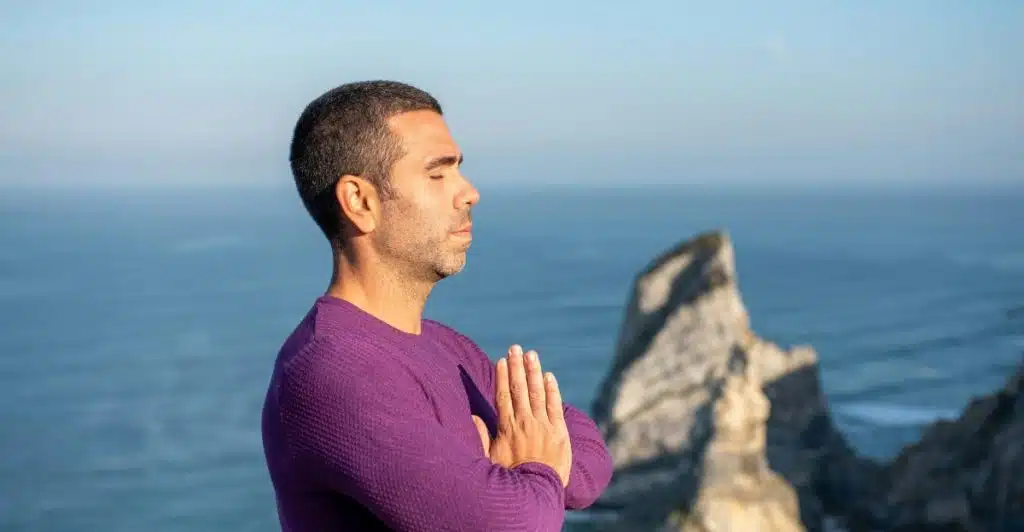 Man Meditating by the Sea