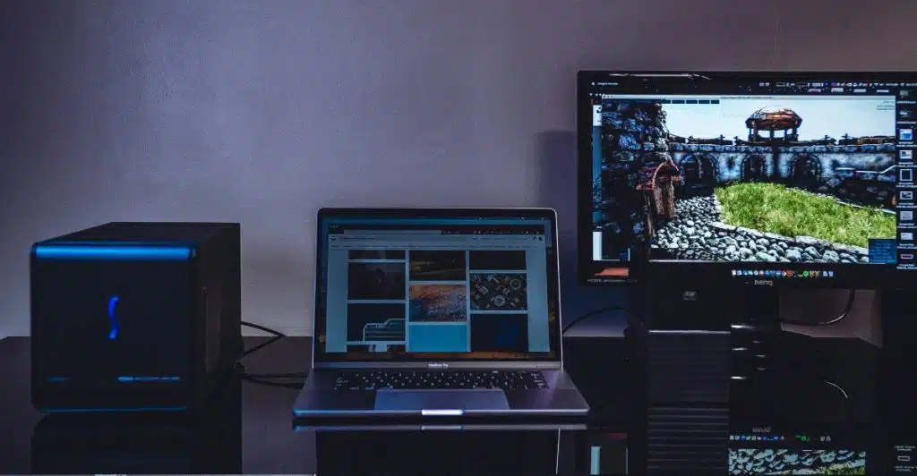 A laptop and computer setup, suggesting the use of streaming devices.