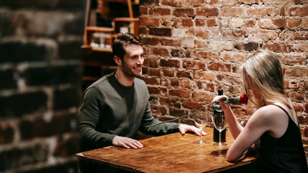 Couple enjoying romantic date at a restaurant.
