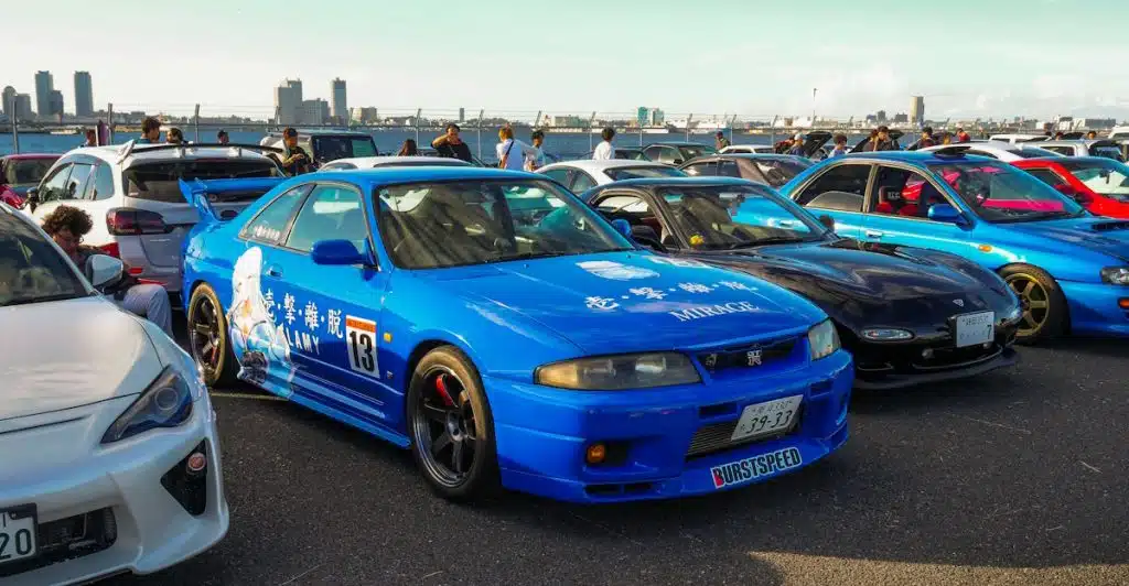 Front view of a Blue 1990s Toyota Supra Parked on a track on a sunny day.
