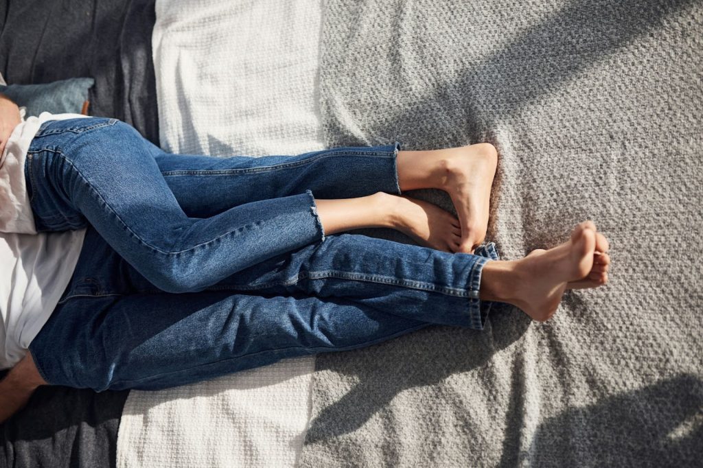 A man and woman wearing denim jeans.