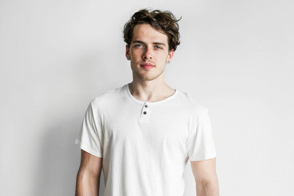 Attractive man wearing henley shirts.