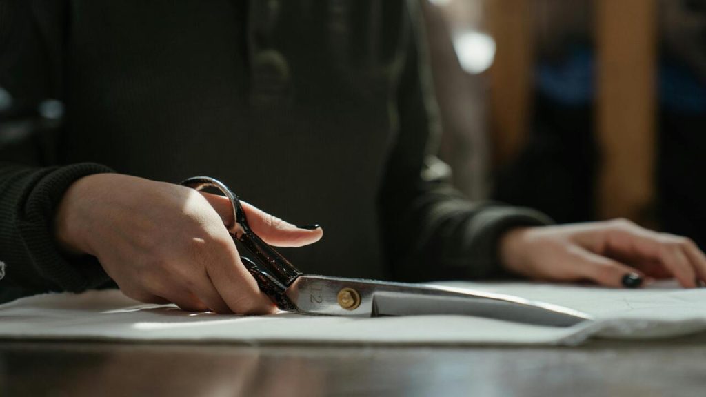 A person cutting fabric