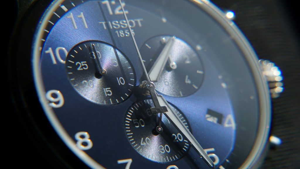 Close-up photo of a chronograph wristwatch.