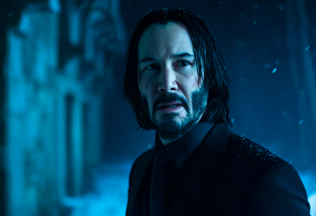  John Wick in all-black suit under moody blue lighting, looking intense in a snowy, nighttime urban setting
